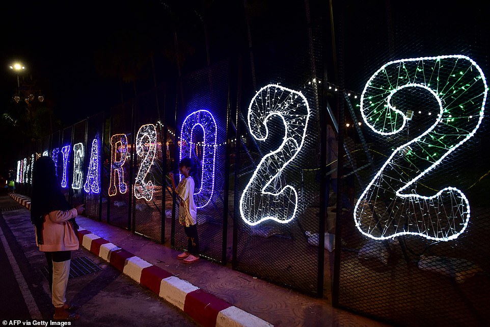 Thousands of Thais took to the streets of Bangkok to usher in 2022, hours after celebrations were kicked off in the Pacific islands