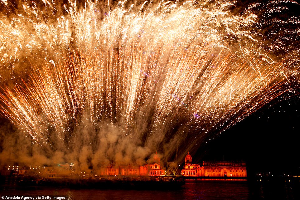 Fireworks explode during a midnight display celebrating the new year at the Old Royal Naval College at Greenwich in London