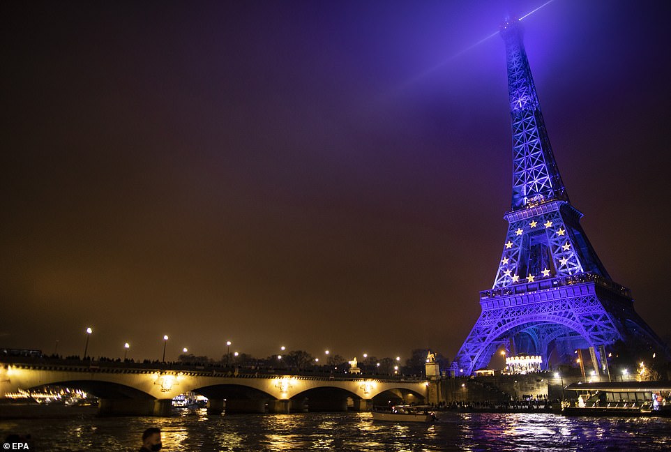 The Eiffel Tower is illuminated in the colors of the European Union flag to mark the start of France presidency in Paris